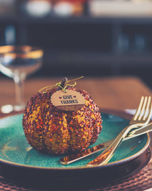 istock Thanksgiving still life with metallic pumpkin and greeting 873425824