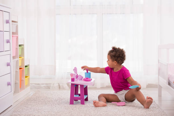 istock Little girl playing with kitchen toys. 873425826