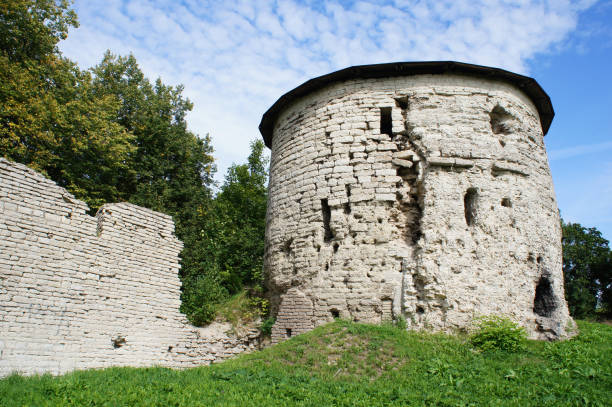istock Landscape white tower with fort wall Pskov, Russia at summer 873428706