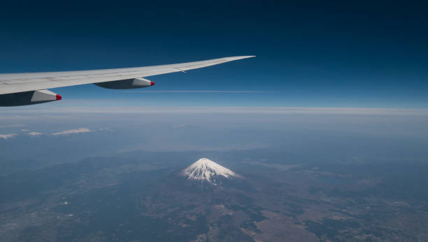 istock A view from the airplane window while flying over Mt. Fuji.. 873434612