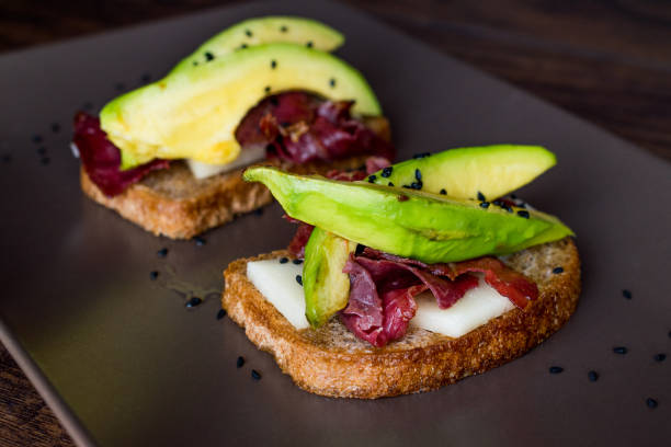 istock Avocado Toast with Pastrami, Cheese and Black Sesame 873435678