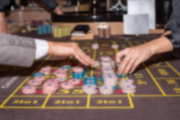 istock Abstract blurred roulette in casino - gambling background 873441878