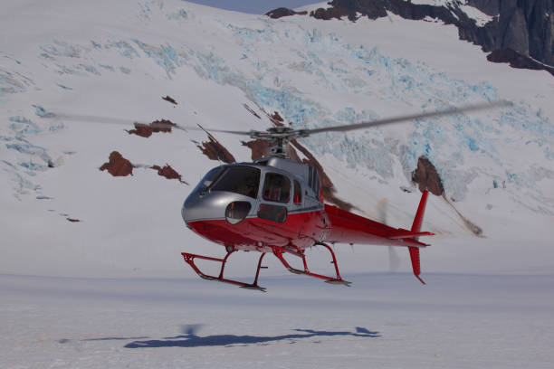 istock Helicopter lands on a glacier 873445052