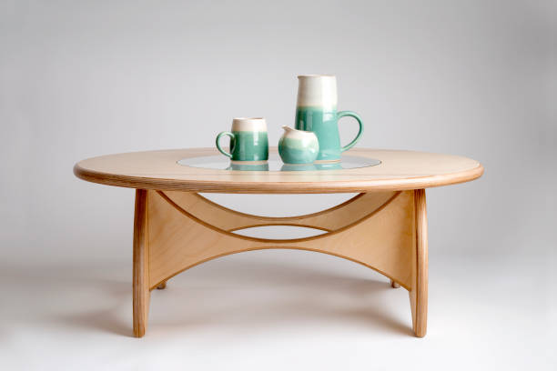 Ceramic drinking set on a natural wood designer round table top