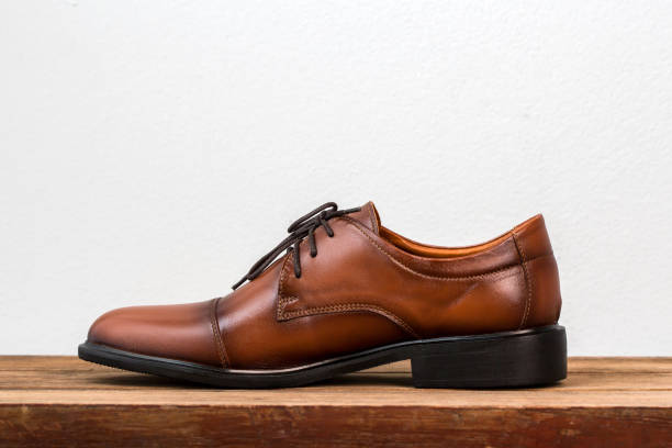 istock Brown fashion leather men shoes on table. 873454720