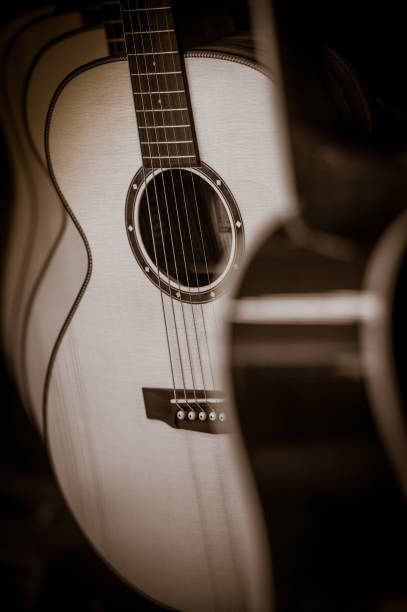 istock Acoustic classical guitars with strings in shop, France 873457710