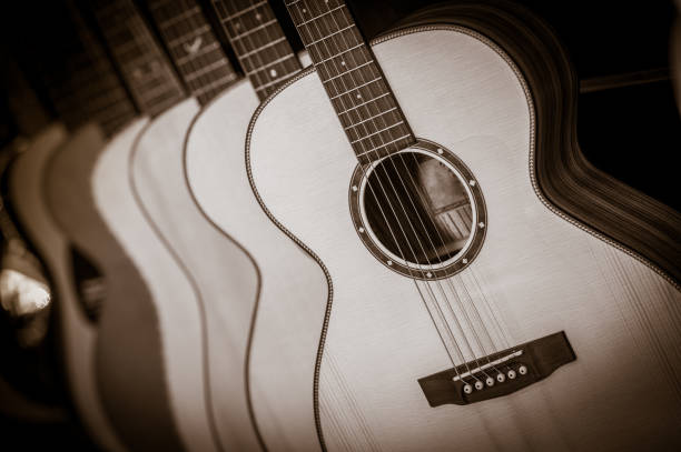 istock Acoustic classical guitars with strings in shop, France 873457734