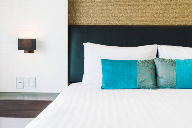istock Pillow on bed decoration in bedroom interior 873462454