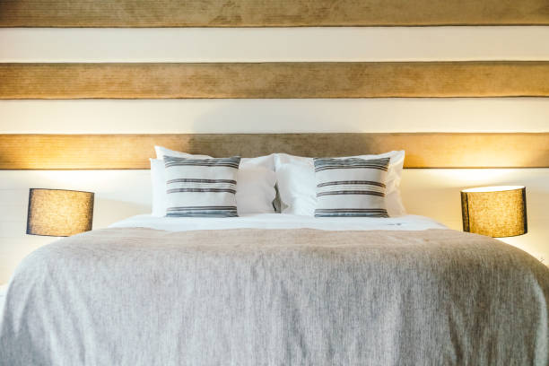istock Pillow on bed decoration in bedroom interior 873462582