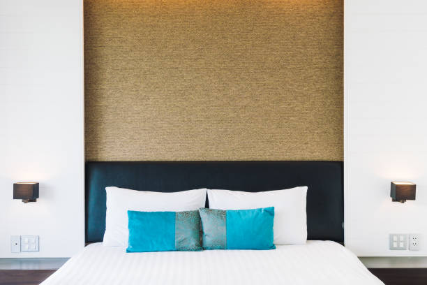 istock Pillow on bed decoration in bedroom interior 873462692