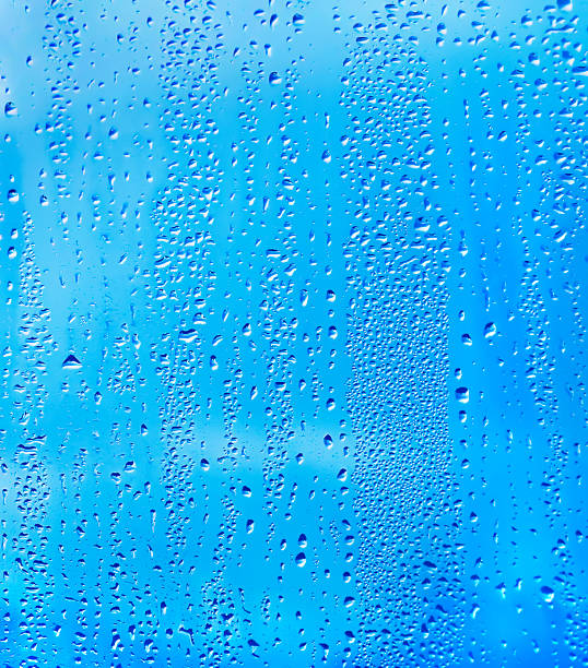 istock natural water drop on glass 873462734