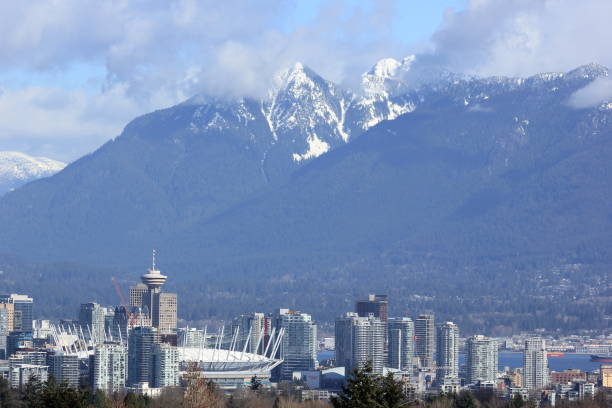 istock Vancouver skyline - snow capped mountain range from Queen Elizabeth Park, on a Spring morning, Vancouver, Canada 873462774