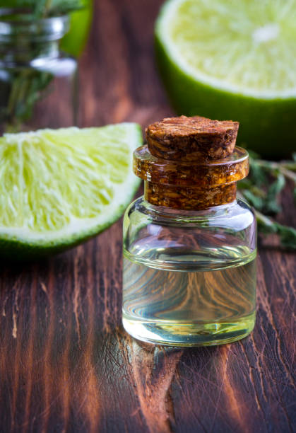 istock lime oil citrus wooden vintage background 873462784