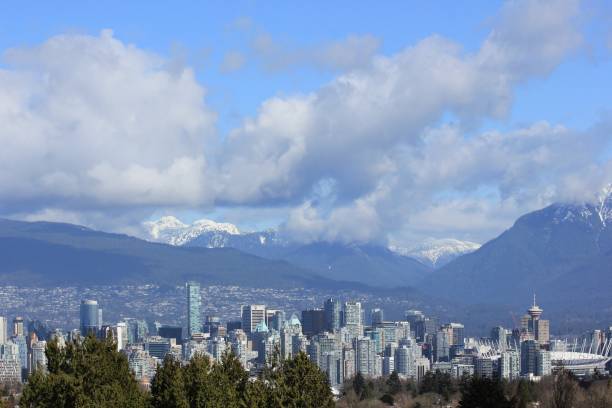 istock Vancouver skyline - snow capped mountain range from Queen Elizabeth Park, on a Spring morning, Vancouver, Canada 873462788