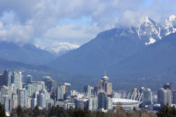 istock Vancouver skyline - snow capped mountain range from Queen Elizabeth Park, on a Spring morning, Vancouver, Canada 873462826