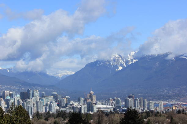 istock Vancouver skyline - snow capped mountain range from Queen Elizabeth Park, on a Spring morning, Vancouver, Canada 873462840