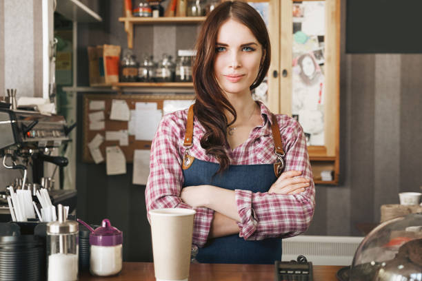 istock Female barista serving a drink 873468582