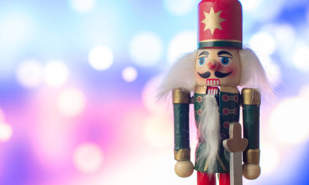 Christmas nutcracker toy soldier traditional figurine with bokeh background Christmas nutcracker toy soldier traditional figurine with bokeh background nutcracker photos stock pictures, royalty-free photos & images