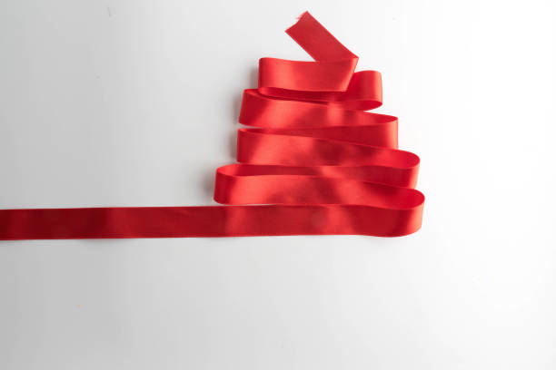 istock red bow ribbon satin texture isolated on white background 873472748