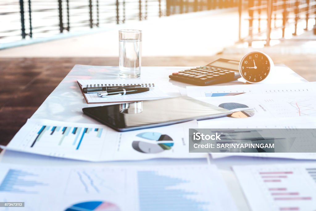 Business office equipment on the business paper. Report chart Retirement Stock Photo Business office equipment on the business paper. Report chart Retirement Stock Photo