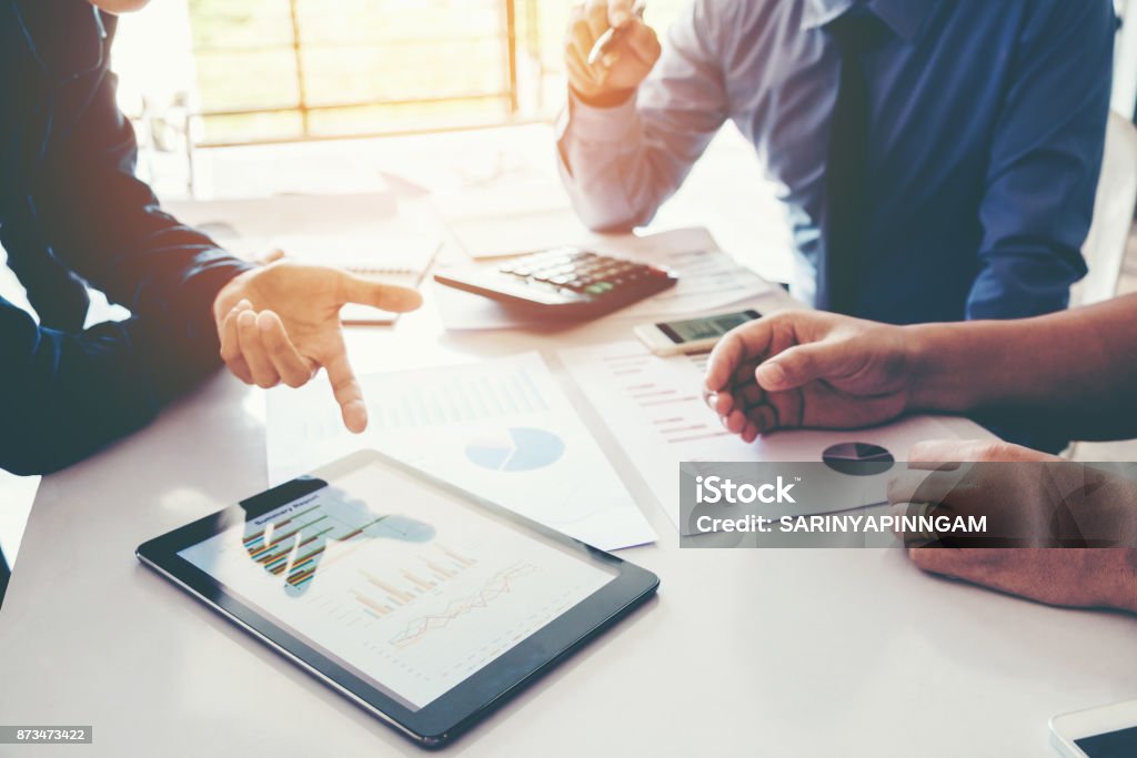 Business team meeting working on digital tablet new business project Digital Tablet Stock Photo