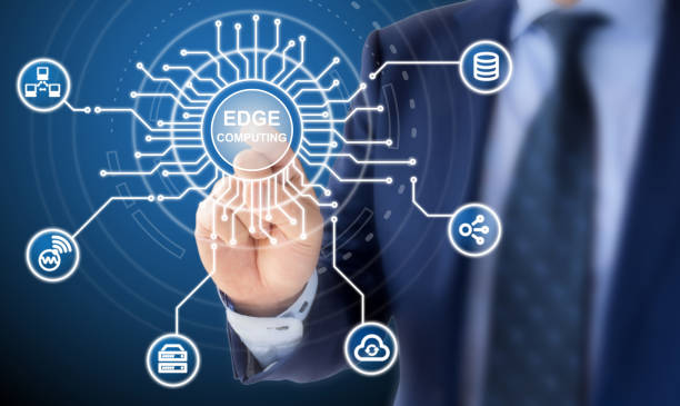 Edge computing circuit diagram explained by IT expert IT expert in a blue suit clicks on a circuit diagram with the words edge computing surrounded by specific icons computer equipment stock pictures, royalty-free photos & images