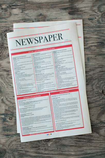 istock Mock up newspaper on wooden background 873480876