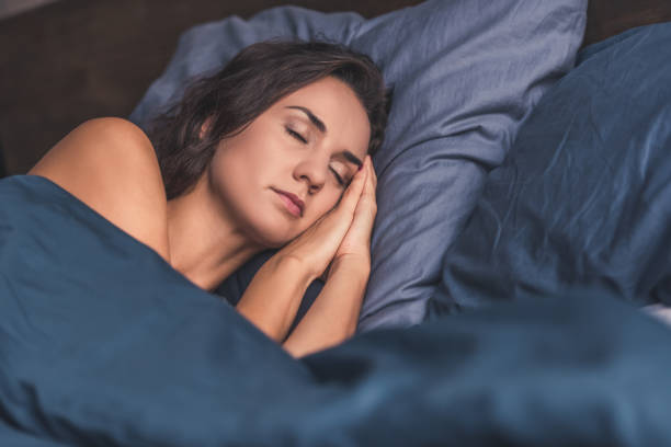 istock Young woman in bed 873484042