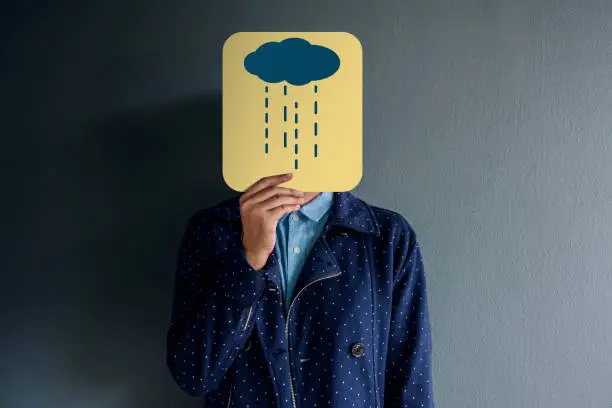 Photo of Customer Experience Concept, Portrait of Client with Sadness Feeling, Drawn Cloudy and Rain on Paper, Poor or Dissappointed in Products and Services