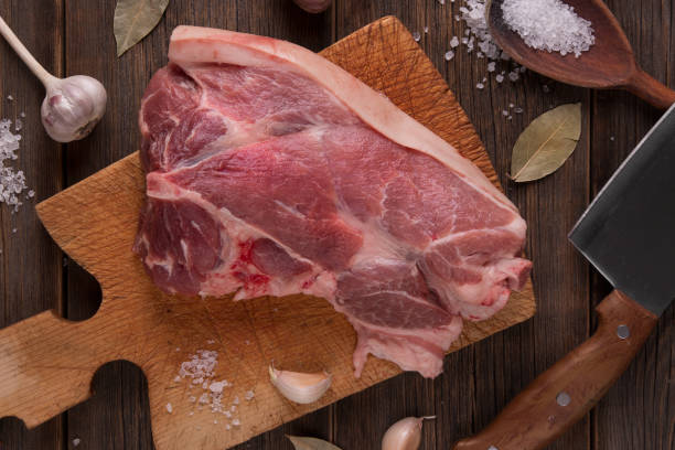 istock A fresh piece of pork ham with spices 873487914