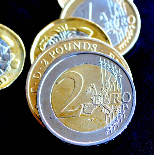 istock EURO and British pund-coins 873492528