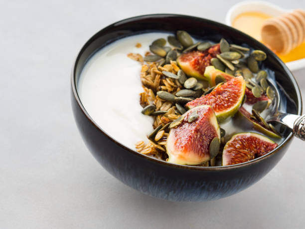 istock Healthy breakfast yogurt bowl with granola and fig 873500340