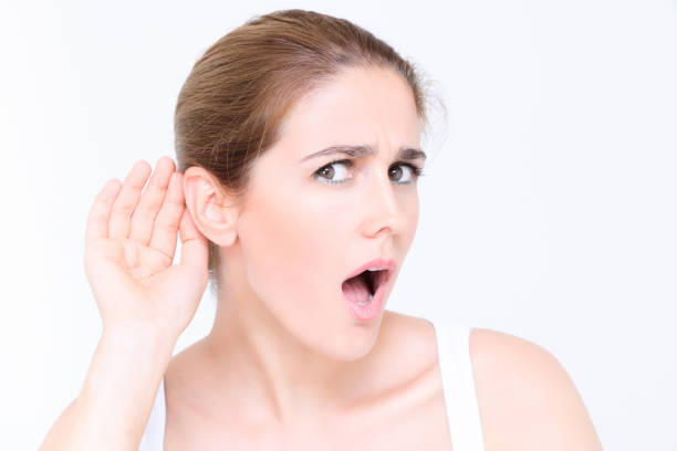 istock Girl listening with her hand on an ear 873507294