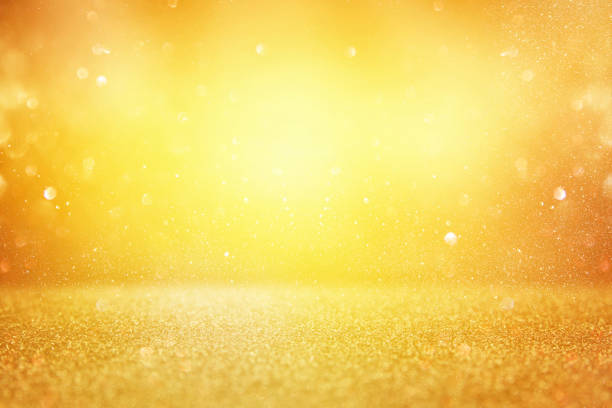 istock Gold glitter vintage lights background. de focused. 873507532