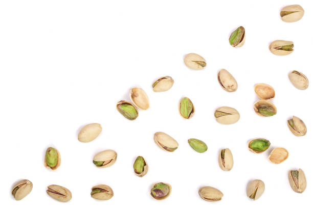 istock Pistachios isolated on white background with copy space for your text, top view. Flat lay pattern 873509378