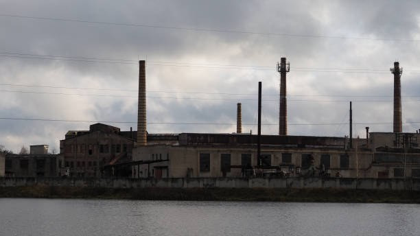 istock Abandoned factory on the river 873512176