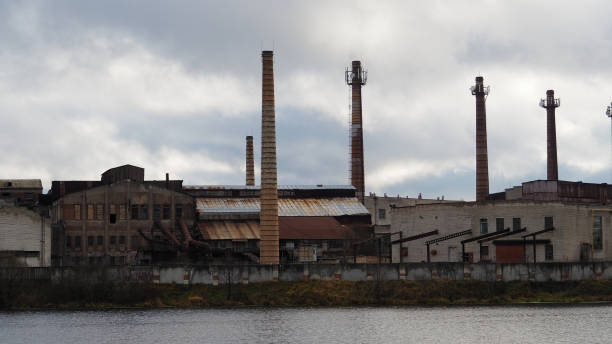 istock Abandoned factory on the river 873512360