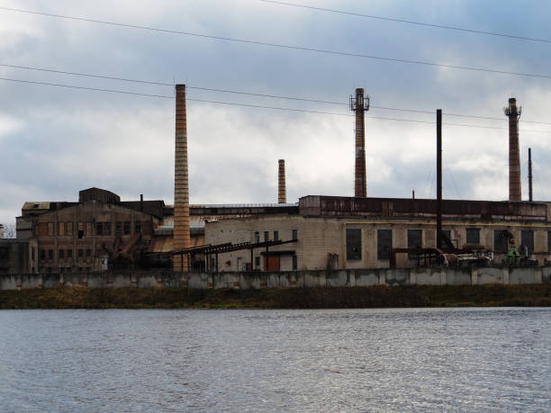 istock Abandoned factory on the river 873512440