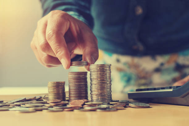 istock concept saving money with hand putting coins stack for finance and accounting 873515608