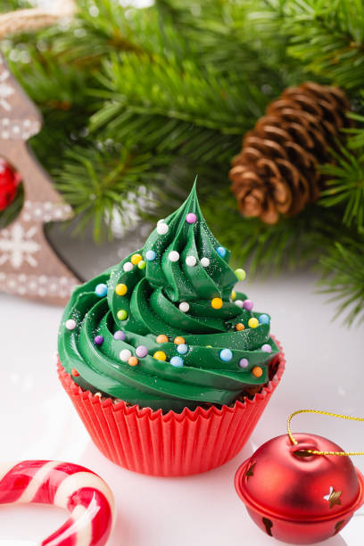 istock Christmas green cupcake in red cup 873515716