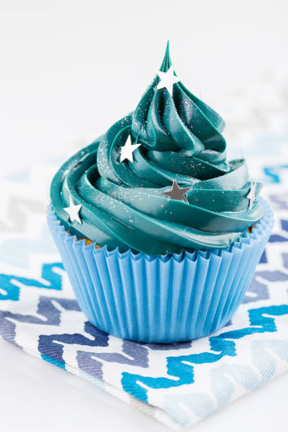 istock Blue cupcake with stars sprinkles 873515762