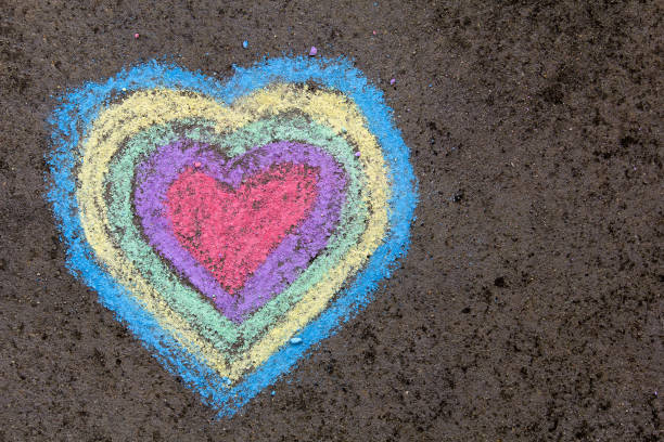 istock chalk drawing: colorful hearts on asphalt 873518582