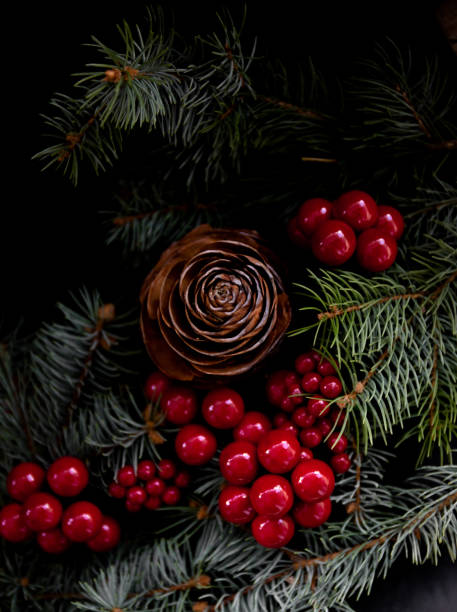 Chritsmas with pinecone , berries and pine needles stock photo