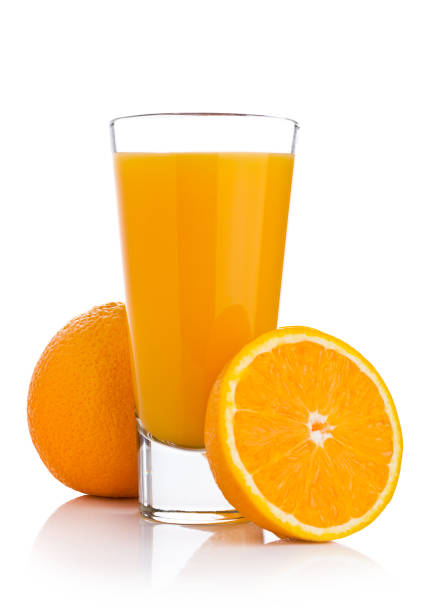 istock Glass of fresh orange juice with fruit bits 873518768