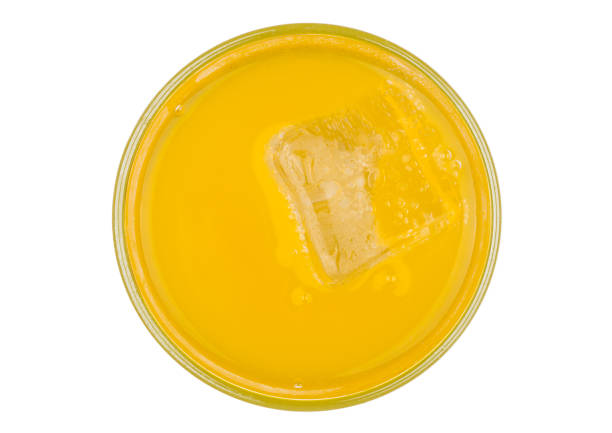 istock Orange soda drink with ice cube top view 873520398