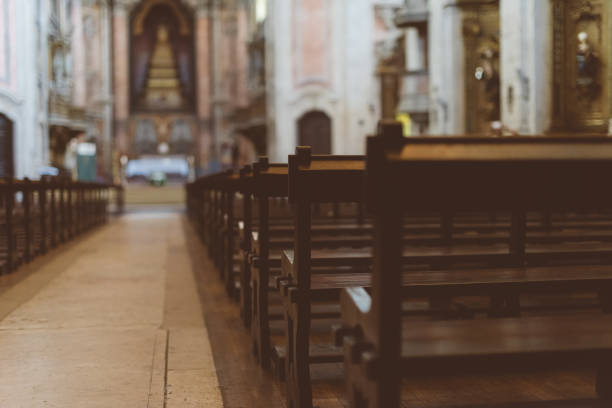 the interior of the church with benches. - pew imagens e fotografias de stock