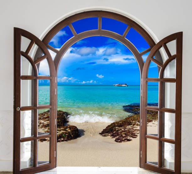 istock wooden open door arch exit to the beach 873523578