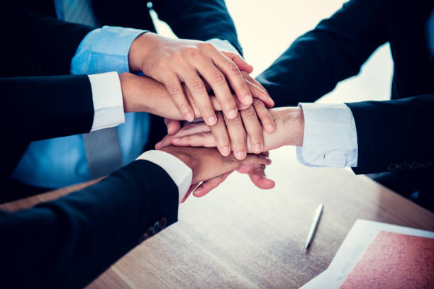 istock business handshake and teamwork for achievement KPI and goal 873526794