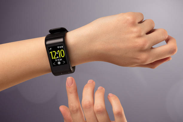 istock Female hand wearing and pressing smartwatch 873531442
