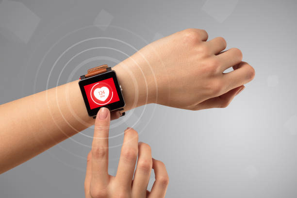 Hand with smartwach and helath concept Naked female hand with smartwatch and with heart rate icon on the watch medical alert wearables stock pictures, royalty-free photos & images